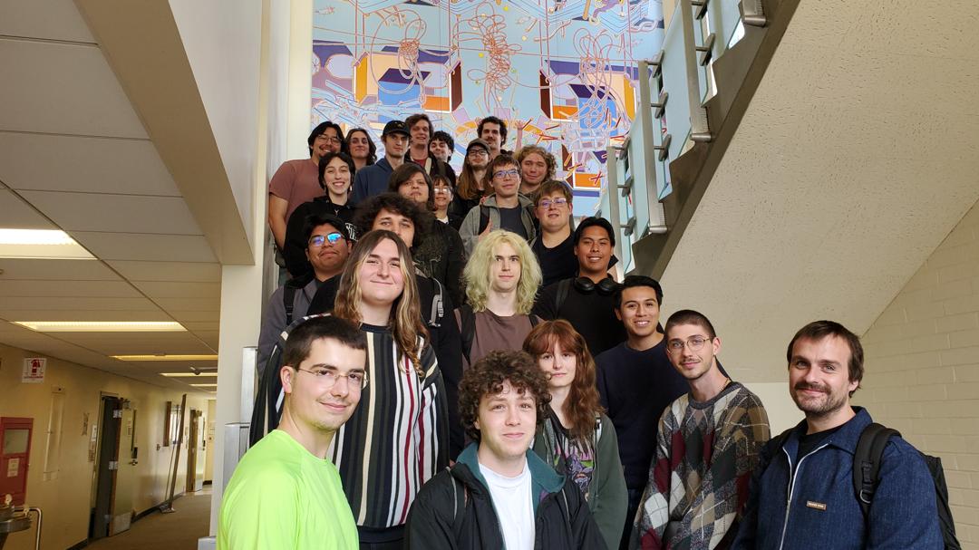 Large group of students standing on stairs for photo