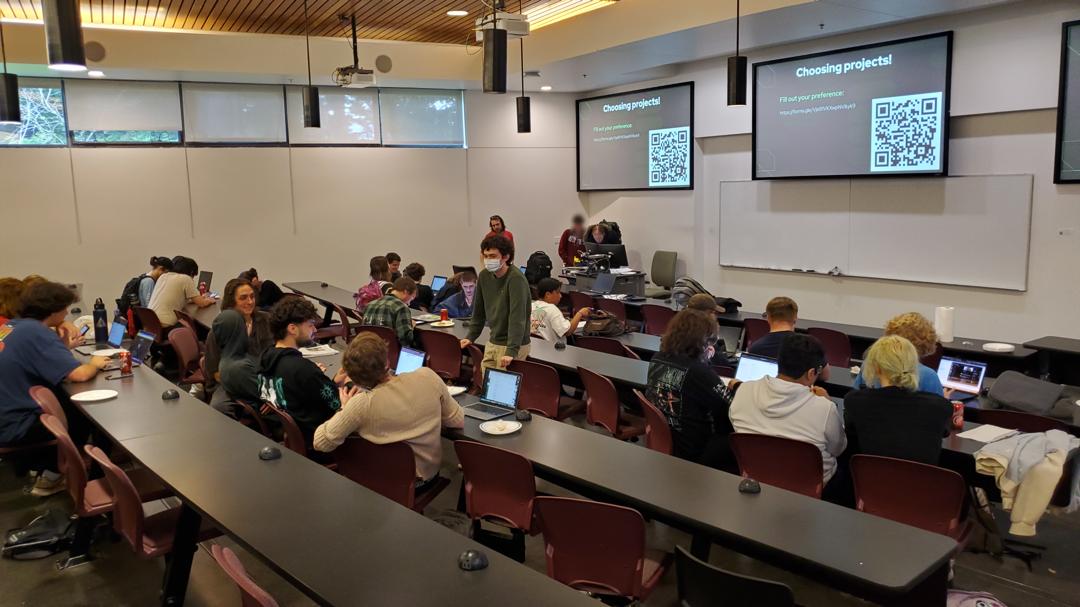 Students sitting at a large club event